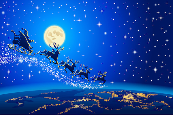 Santa, sleigh, and reindeer flying high over the earth in blue night's sky, with lights from city beneath them and moon overhead