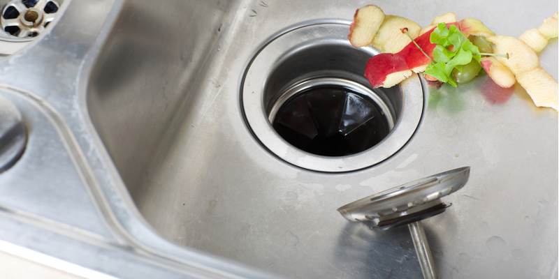 how to remove a garbage disposal in kitchen sink