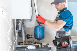 Professional installing a gas furnace