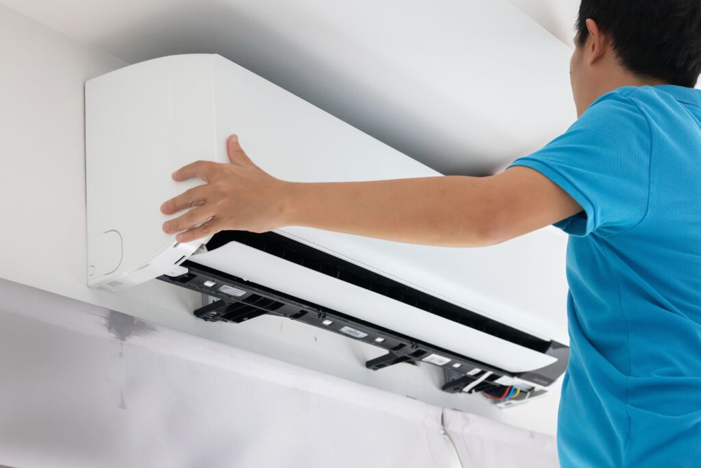 technician completing smart AC installation that works right the first time in modern home