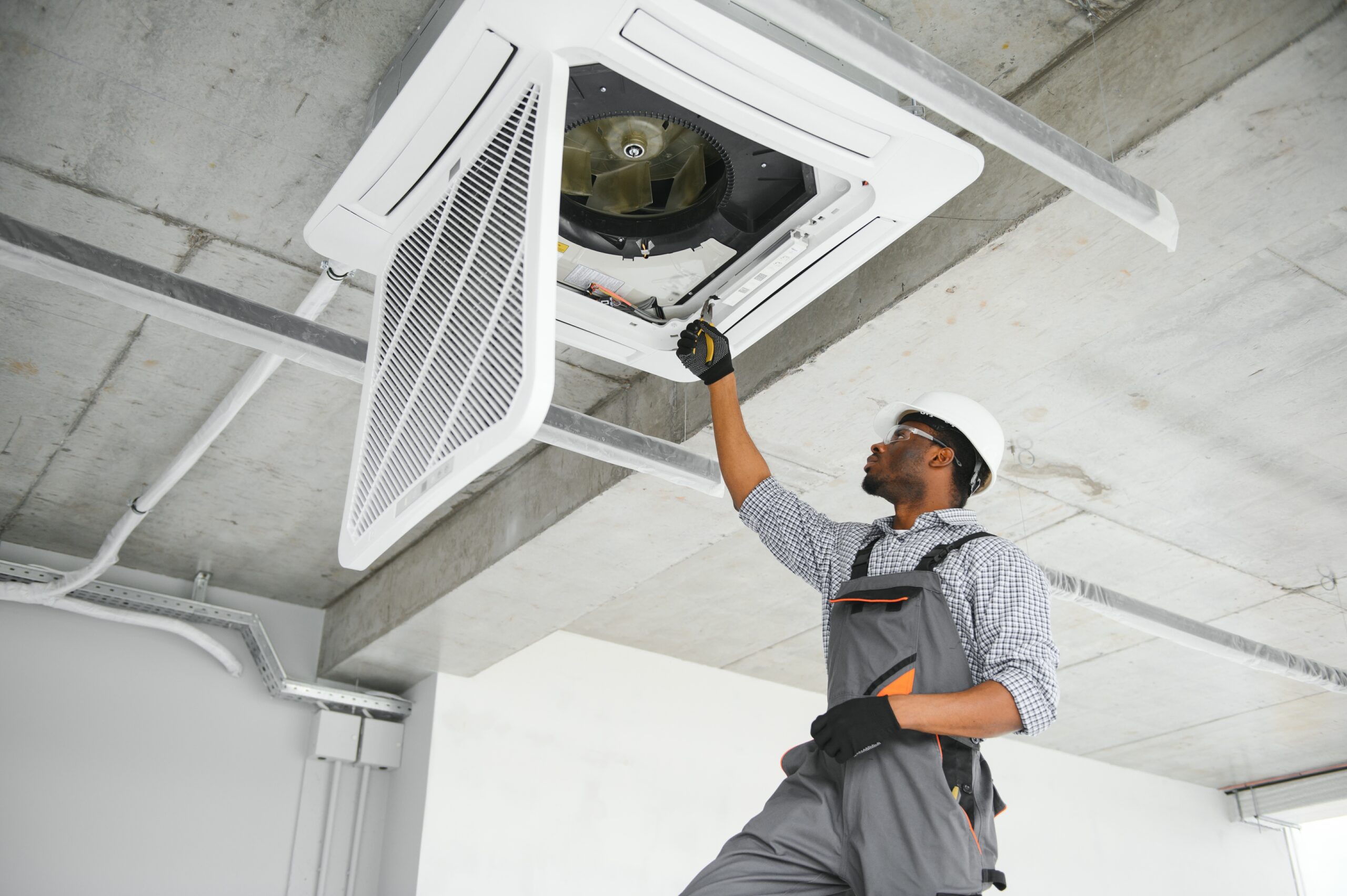 technician inspecting unit showing why considering AC repair demands your immediate attention