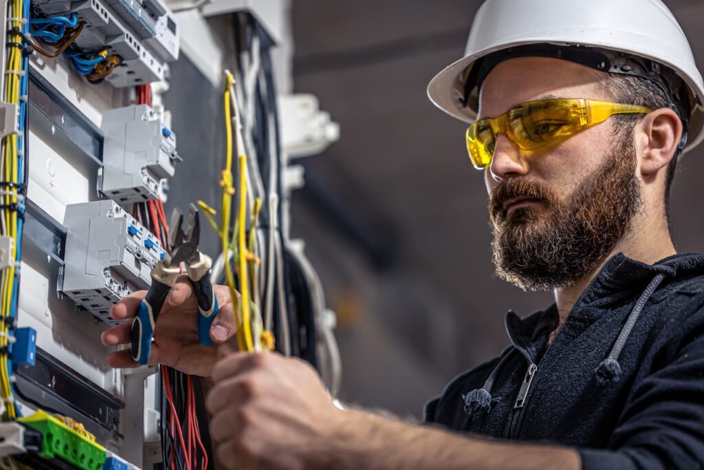 Homeowner consulting an electrician to choose electricians for better living solutions