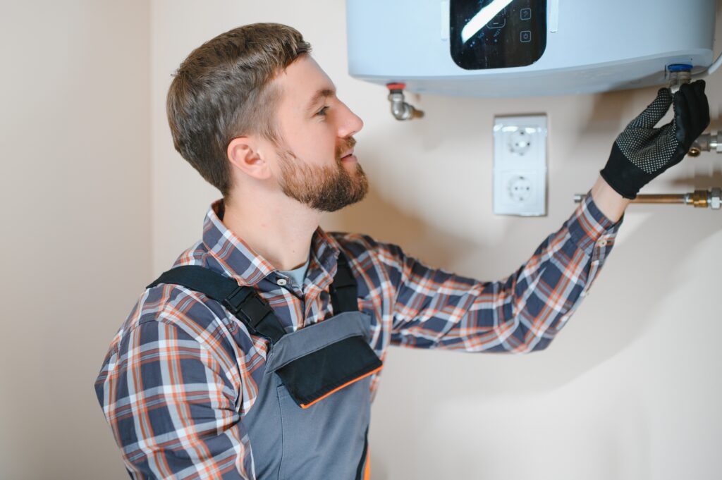 Technician providing 24 hour water heater repair service at home